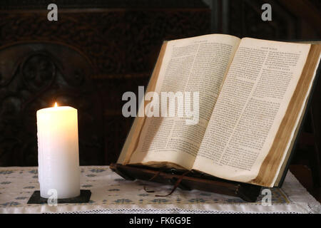 Old Bible and church candle, Carouge Protestant temple, Geneva, Switzerland, Europe Stock Photo