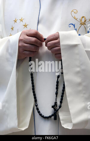 Hand-carved Roman Catholic rosary beads, priest praying The Mystery of the Holy Rosary, Haute Savoie, France, Europe Stock Photo