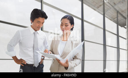 Composite image of estate agent showing lease to customer Stock Photo