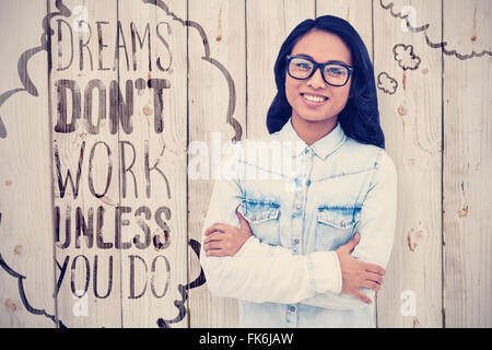 Composite image of asian woman with arms crossed smiling Stock Photo