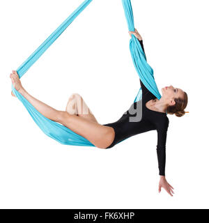 Woman hanging in aerial silk, isolated on white Stock Photo