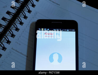 Tinder dating app on smartphone Stock Photo