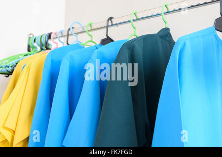 fashion clothing on hangers at the show Stock Photo