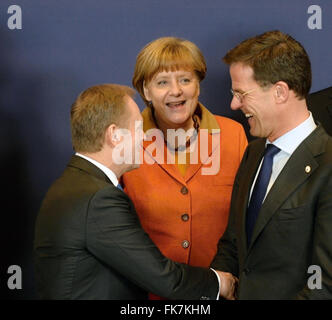 Brussels, Belgium. 07th Mar, 2016. European Council President Donald Tusk, from left, German Chancellor Angela Merkel and Dutch Prime Minister Mark Rutte chat during a group photo at an EU summit in Brussels, Belgium on Monday, March 7, 2016. European Union leaders are holding a summit in Brussels on Monday with Turkey to discuss the current migration crisis. © Jakub Dospiva/CTK Photo/Alamy Live News Stock Photo