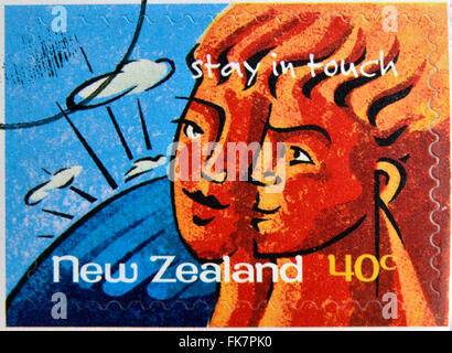 NEW ZEALAND- CIRCA 1998: A stamp printed in New Zealand shows couple, stay in touch, circa 1998 Stock Photo