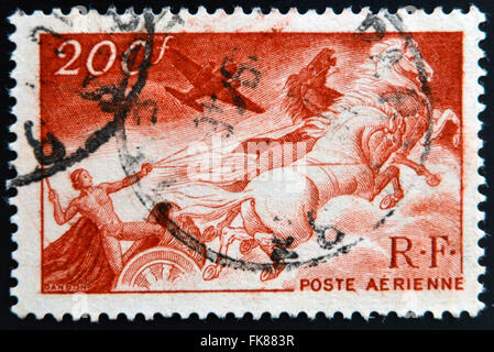 FRANCE - CIRCA 1946: A stamp printed in France shows Apollo on the chariot of the sun, circa 1946 Stock Photo