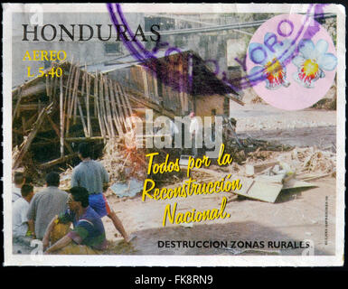 HONDURAS - CIRCA 1998: A stamp printed in Honduras dedicated to rural reconstruction of destroyed, circa 1998 Stock Photo