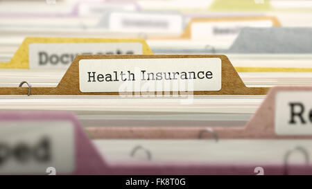 Folder in Catalog Marked as Health Insurance. Stock Photo