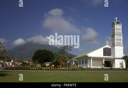 Church in La Fortuna with Volcan Arenal in distance, Guanacaste, Costa Rica Stock Photo