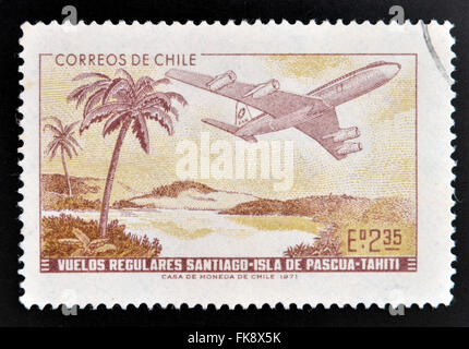 CHILE - CIRCA 1972: A stamp printed in Chile commemorates the establishment of regular flights from Santiago de Chile Stock Photo