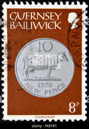 GUERNSEY - CIRCA 1979: A stamp printed in Guernsey shows Ten New Pence, 1970, circa 1979 Stock Photo