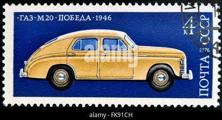 USSR - CIRCA 1976: A stamp printed in USSR shows a profile of a GAZ-M-20 Pebeda passenger car, circa 1976. Stock Photo