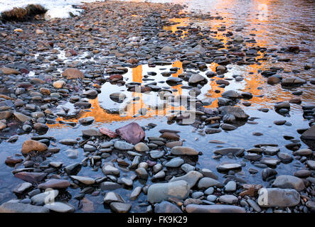 Leaderfoot viaduct reflected in the water of the River Tweed near Melrose in the Scottish Borders at sunrise in winter Stock Photo