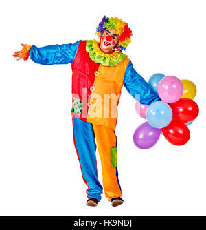 Happy birthday clown holding a bunch of balloons. Stock Photo