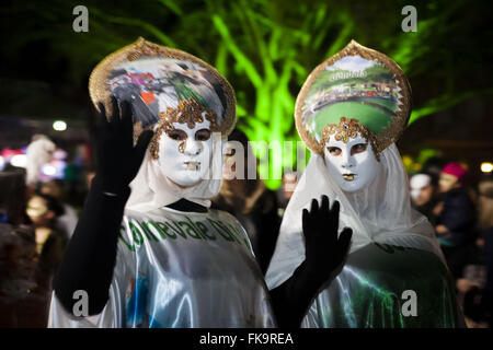 Masked revelers celebrating Carnevale di Venezia called Stock Photo