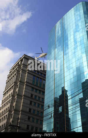 Helicopter takes off from the helipad commercial building of Avenida Luis Carlos Berrini Engineer Stock Photo