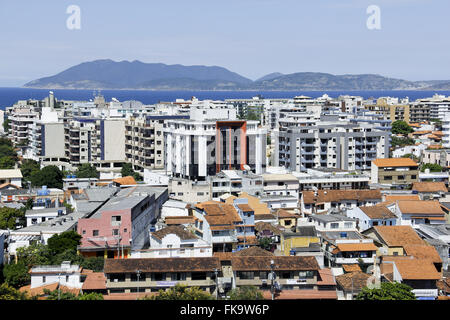 Top view of houses and buildings in the city center with sea in the background in Rio coast Stock Photo