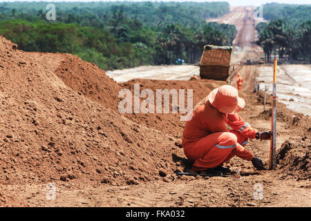 Worker works in Cuiaba Santarem highway BR-163 Stock Photo