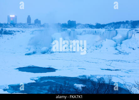 The American Falls almost completely frozen during a cold winter in Niagara Falls, Niagara County, New York, USA. Stock Photo