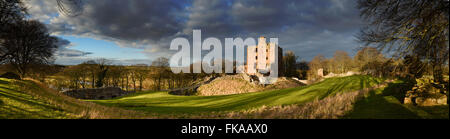 View of the keep of Norham Castle bathed in late afternoon sunshine, the most dangerous place in England. Stock Photo