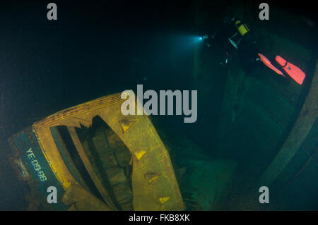 Diver at the MS Zenobia shipwreck. MS Zenobia was a Swedish built Challenger-class RO-RO ferry launched in 1979 that capsized an Stock Photo