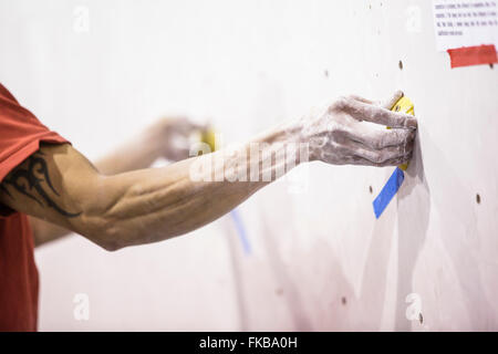 Climbers take part in a bouldering competition at Bloc climbing centre, Bristol. Stock Photo