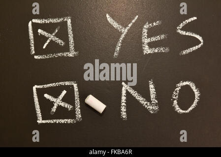 Yes No vote chalk board ballot voting votes Stock Photo