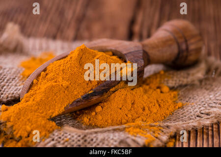 Portion of Turmeric (selective focus) on an old wooden table Stock Photo