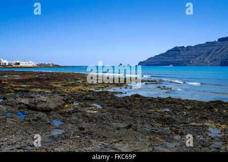 Volcanic rocks coastline in Caleta de Sebo, La Graciosa, Lanzarote, Canary Islands, Spain,Europe. Stock Photo