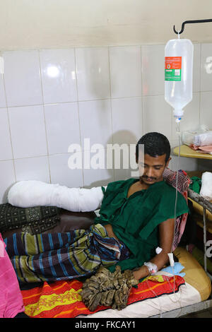 Bangladeshi Tree man Abdul Bajander rests after a surgery at Dhaka Medical College Hospital in Dhaka on Feb. 23, 2016. Stock Photo