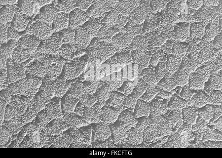 Gray plaster with abstract texture in the sunlight. Taken on the facade of a residential building in close-up. Stock Photo
