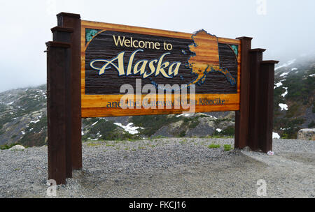 Welcome to Alaska sign at the border crossing along the Klondike Highway Stock Photo