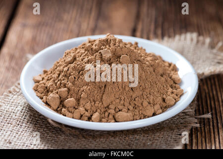 Portion of Guarana Powder on dark wooden background Stock Photo