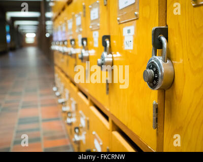 Combination locks on wooden lockers in a hallway at the Central Academic Building at the University of Alberta. Edmonton, Canada Stock Photo