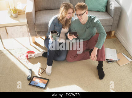 Young couple watching movie on digital tablet Stock Photo
