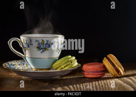 Tea and macaroons on table Stock Photo