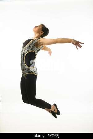 young dancer woman jumping against white background Stock Photo - Alamy