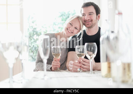 Couple sitting at table Stock Photo