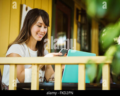 Young woman using phone Stock Photo