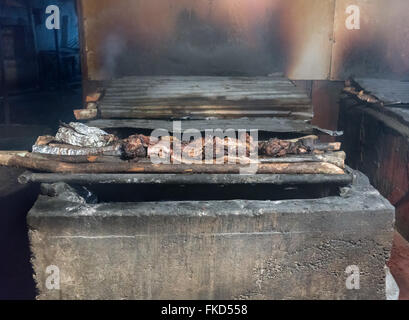 Jerk chicken Preparing on barbecue grill in commercial kitchen, Jamaica Stock Photo