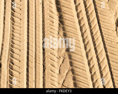 Tire tracks in sand Stock Photo