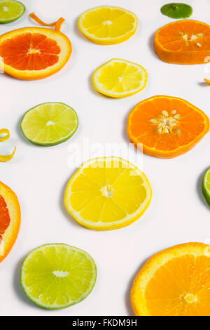 Bright colorful design of various citrus fruit slices with oranges, lemons, limes, grapefruit and tangerines. Stock Photo