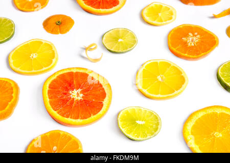 Bright colorful design of various citrus fruit slices with oranges, lemons, limes, grapefruit and tangerines. Stock Photo