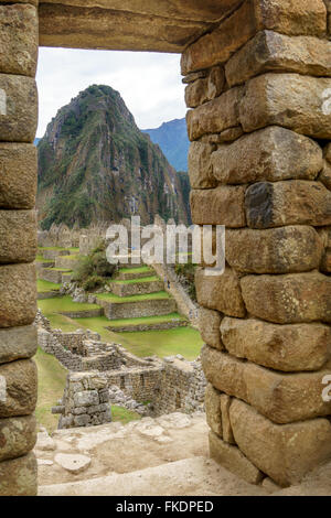 View of mountain peak through window in Machu Picchu, Cusco Region, Urubamba Province, Machupicchu District, Peru Stock Photo