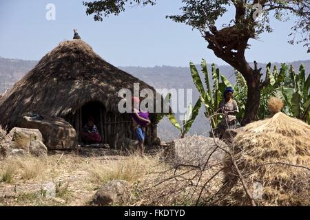 An Ethiopian family outside their house. Stock Photo
