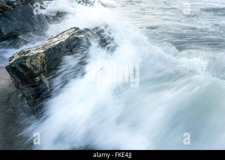 Waves breaking against rocks on the coast, Trinidad, Trinidad And Tobago Stock Photo