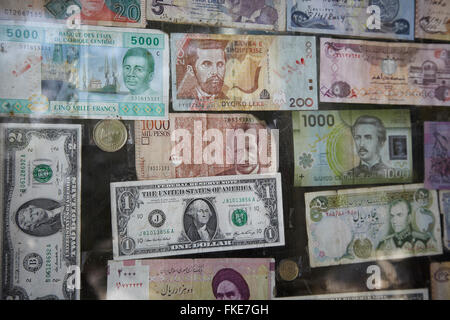 One dollar bill among many different notes on a wall in Iraqi Kurdistan. Stock Photo