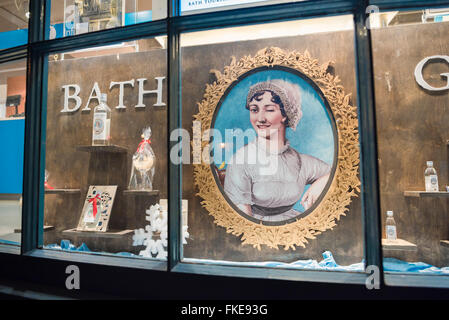 Jane Austen Bath UK, a display of Bath Gin in the window of a shop in the centre of the city of Bath makes use of a large portrait of Jane Austen. Stock Photo