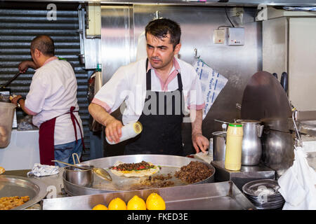 Men cooking in a cafe, Istanbul, Turkey Stock Photo