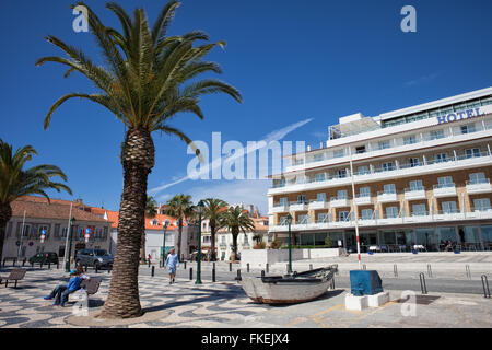 Portugal, promenade in resort coastal town of Cascais, Hotel Baia on the right Stock Photo